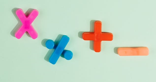 Photo by Karolina Kaboompics: https://www.pexels.com/photo/math-symbols-in-various-colors-on-blue-surface-5412101/